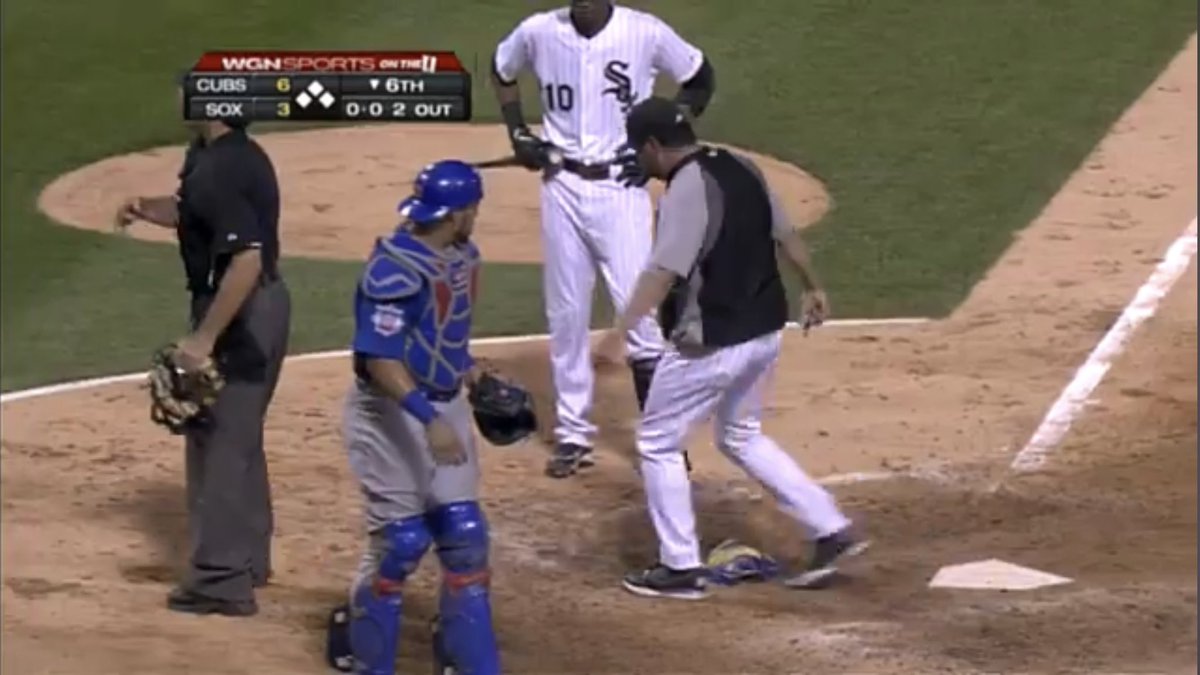 PrazMaster's tweet photo. Ozzie Guillen kicking Geovany Soto’s mask while arguing with an umpire in 2011 and Soto clowning him to the Cubs dugout. 😂 https://t.co/9i2kcvFvsI