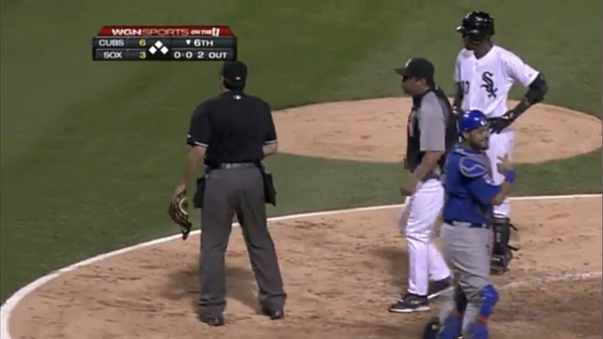 PrazMaster's tweet photo. Ozzie Guillen kicking Geovany Soto’s mask while arguing with an umpire in 2011 and Soto clowning him to the Cubs dugout. 😂 https://t.co/9i2kcvFvsI