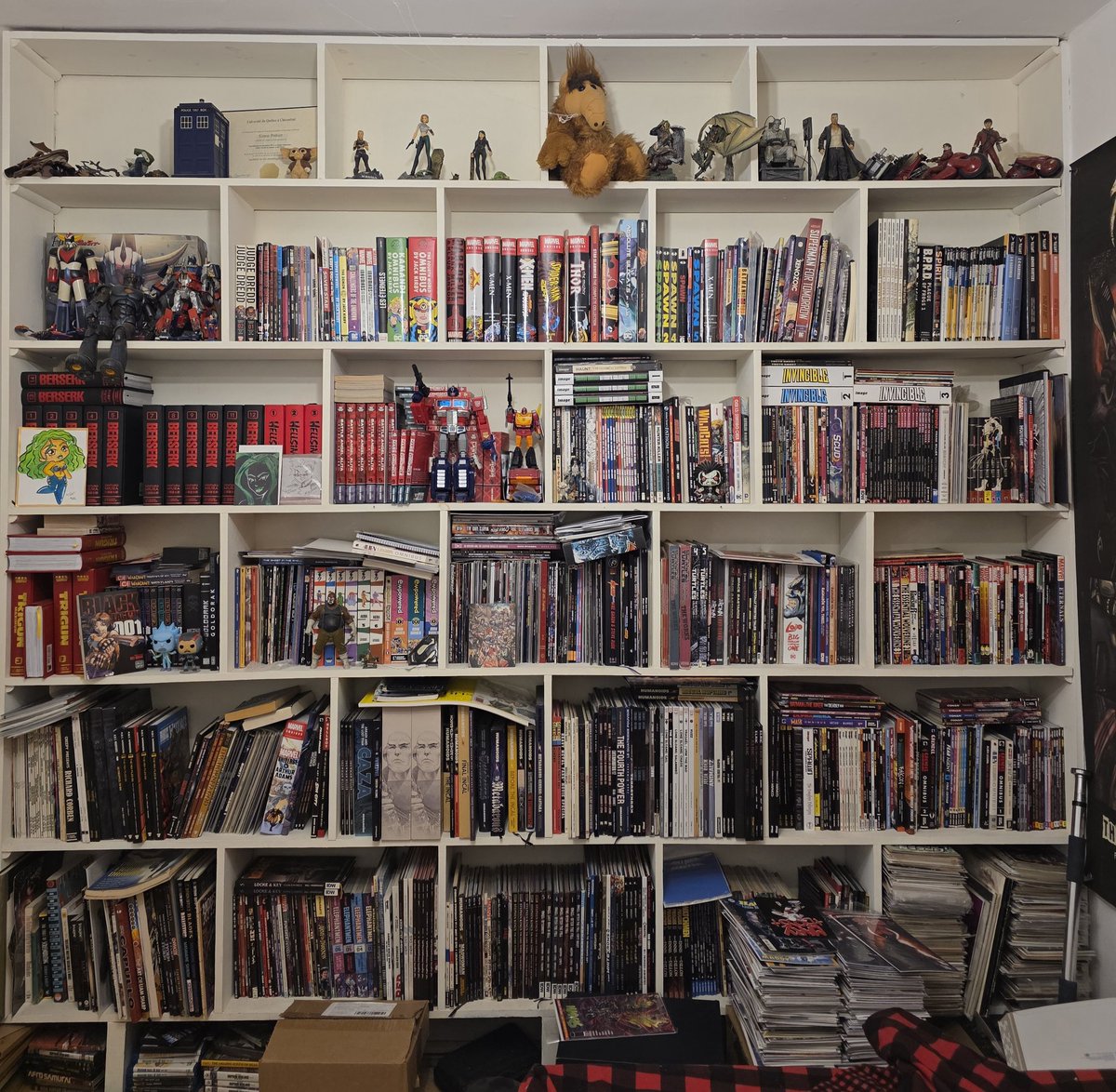 Simon_Pothier's tweet photo. My collection in my room librairy wall. ;) #comics #collector I still have a fews boxes of floppies in the closet. https://t.co/jgQ3txsW2q