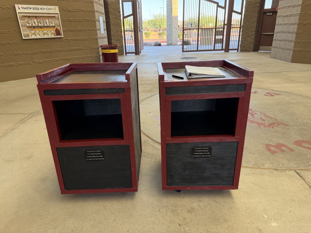 ShadowRidgeHS's tweet photo. Congratulations to Callum Smith for completing his Eagle Scout project and making podiums to provide to the English department. Ms. Waldon is the recipient of one of the podiums. Great job, Callum! https://t.co/hIdWfJINpz