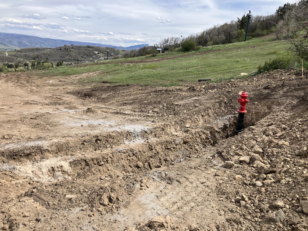 slopefillers's tweet photo. @liftblog I'm curious to see how it all fits together. The road they're building is taking up about half the run right now (all the stuff north of Crocket). They already have fire hydrants, electrical, etc. going in for the commercial/residential stuff. https://t.co/FOmbKFlmn5