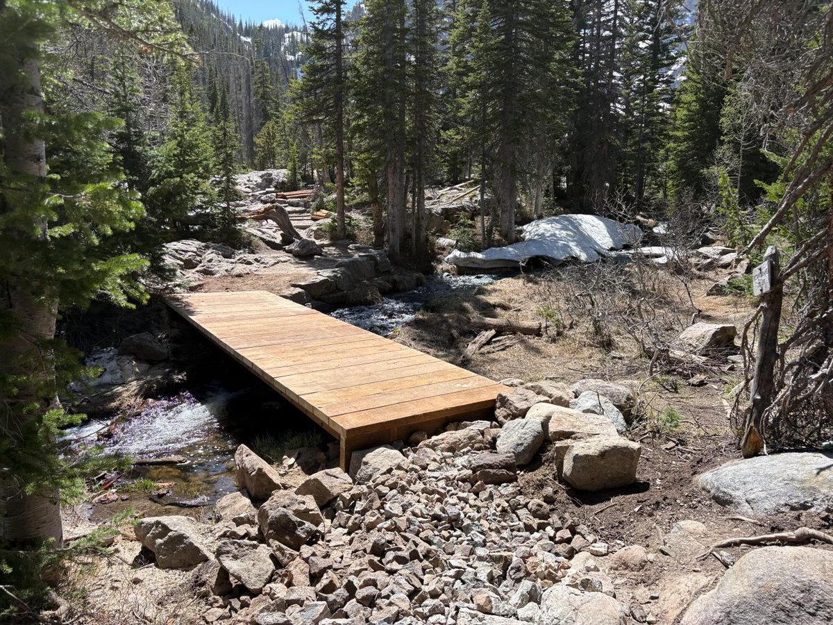 RockyNPS's tweet photo. The #RMNP trail crew has completed the bridge replacement project just above Nymph Lake and the trail between Nymph and Dream Lakes has reopened.

Trail crew members need to complete a few final touches, like adding the side rails, next week but the bridge is ready for use.

The trail closure that was planned for next week will not be needed. Thank you to all trail crew members for replacing this bridge and your hard work!