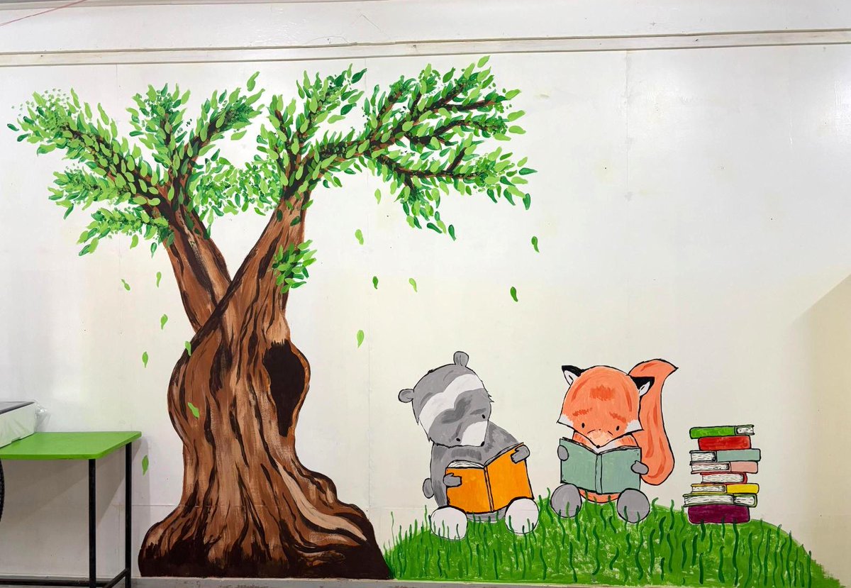 peacecorpguyana's tweet photo. #PeaceCorps Volunteer Caroline teamed up with colleague Avery to create a child-friendly mural filled with imagination and warmth to update her school’s library! 📚📚📖We love the creativity. #PeaceCorpsGuyana #Service #MakingLearningFun 🇬🇾 https://t.co/XTi9OhsrGf