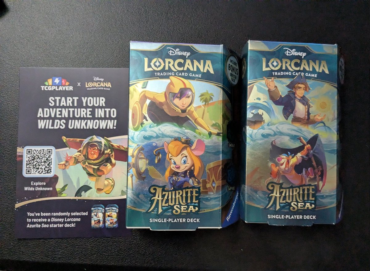 Got a random promo order from @TCGplayer with two Lorcana starter decks   I'm too broke to play another card game guys if you want me to play you'll  have to send