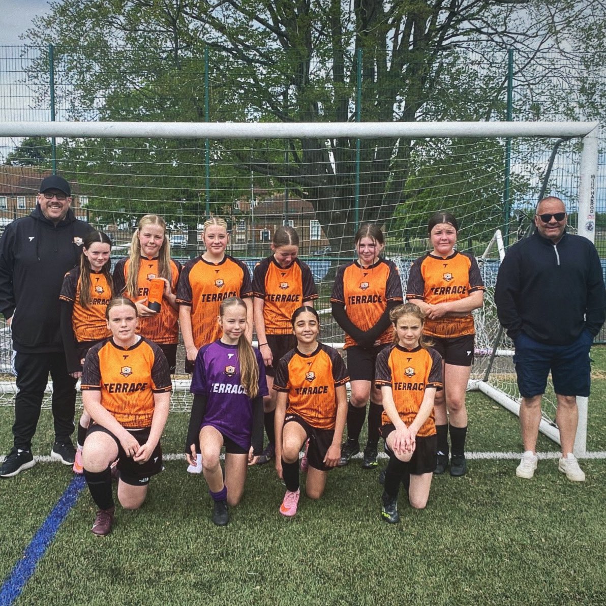 TerraceCarl's tweet photo. First season as a gaffer completed, to my daughters u13 team. 

There’s been blood, sweat, tears and far too many references to the numbers 6 and 7 but we wouldn’t change a thing. 

Extremely proud of the girls and here’s to next season! 🧡🖤 https://t.co/Tw4jwHQYIh