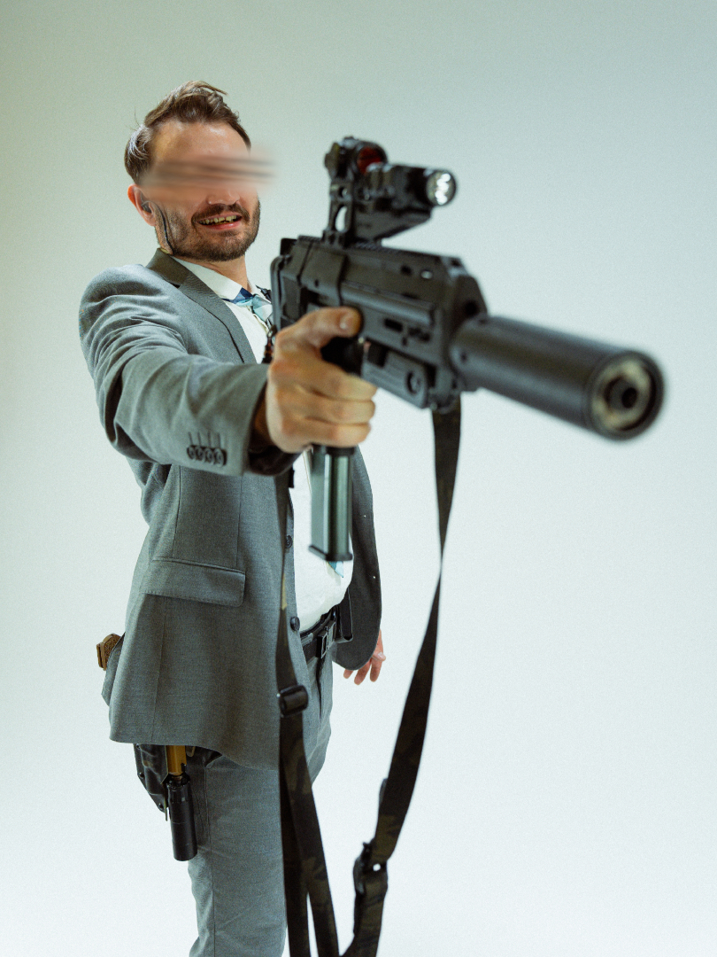 AXLADVANCED's tweet photo. Suits and MP7s? We're so back. https://t.co/Zmmtqtsu97