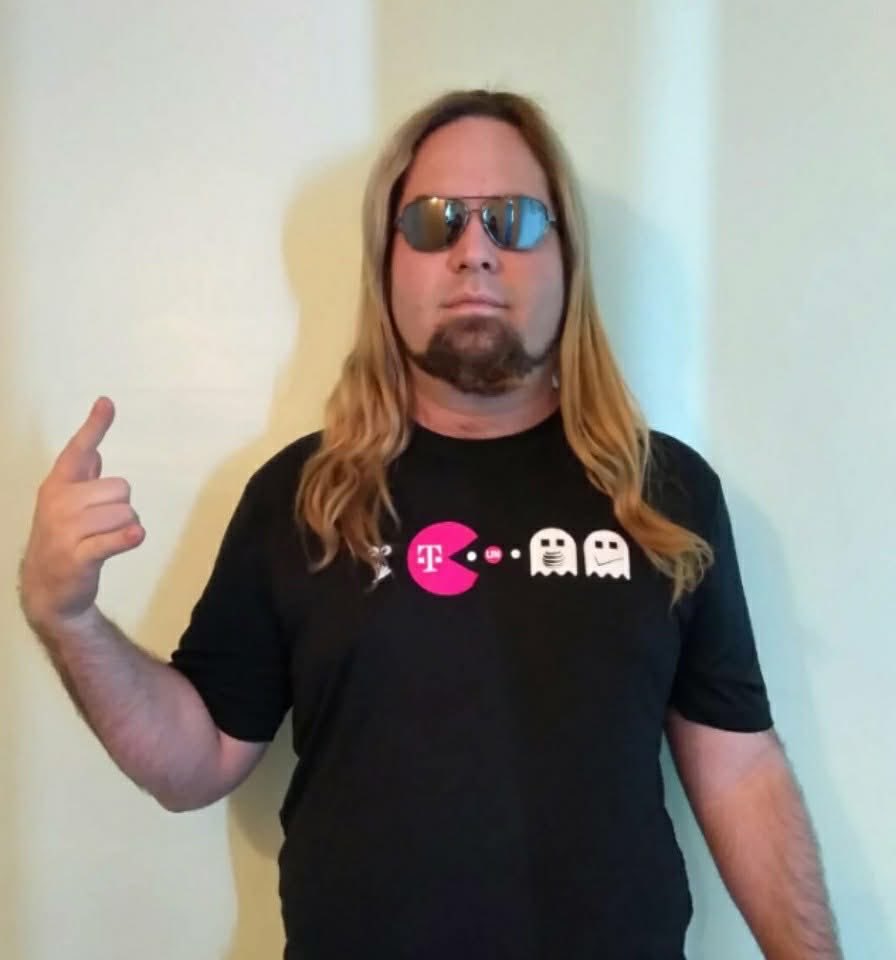 Axellent33's tweet photo. @TMobile @TMobileHelp remember this shirt? Sent to me by John Legere himself. I miss him https://t.co/vTtsDZUS74