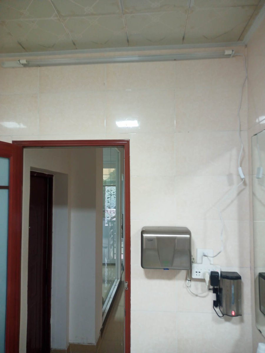 NukitToBeSure's tweet photo. Normally, I like 254nm over 222nm whenever possible because it's so, so much less expensive per watt of output, but bathrooms are harder than expected.

Right before China came out of COVID-Zero I put GUV in my bathrooms in anticipation of infected neighbors and potential transmission through plumbing. 

Initially, I found some nice fixtures with built-in PIR sensors. Unfortunately, PIR is nowhere near robust enough for 254nm- if you sit too still on the toilet, it comes blasting on, cooking your eyeballs while you wave your hands frantically to turn it off. I added microwave sensing to that, and it no longer came on when occupied.

The next problem was that the white tile is a pretty decent reflector of UV- so with the door open, all that UV came out into the house. My dogs like to lie in front of the bathroom, and my makeup table was right next to it. It wasn't a super high dose, but it was enough that sustained exposure posed a risk. 

I added interlocks to the bathroom doors so the GUV would only turn on if the door was closed and no one was in the bathroom. A lot of wiring and hassle, but it worked. 

Even then, it wasn't safe for sequential use. I typically offer the bathroom to women delivery drivers (not that I exclude men who ask, they are very safe and polite, but I am proactive with women because we tend to need it more). That use puts the bathroom out of commission for about 5 minutes while I close the door after they leave, the 254nm lights come on, and any suspended aerosols are inactivated.

254nm also can't be on while I shower- and I have very long hair, so washing it takes a really long time, during which I am entirely unprotected from anything coming out of the drains, which, as we have established, seems to be a primary infection route here in China. 

So 254nm can be made to work, but it's complicated, and the protection isn't really optimal. In the end, 222nm really has the edge here, the final cost of a Lantern is almost the same as a 254nm install, and the bathroom is still the place I think most people should install it first if they can afford only one unit. 

If you can only budget for 254nm, are handy, and willing to deal with mains voltage, let me know, and I'll put together a parts list for you to DIY.