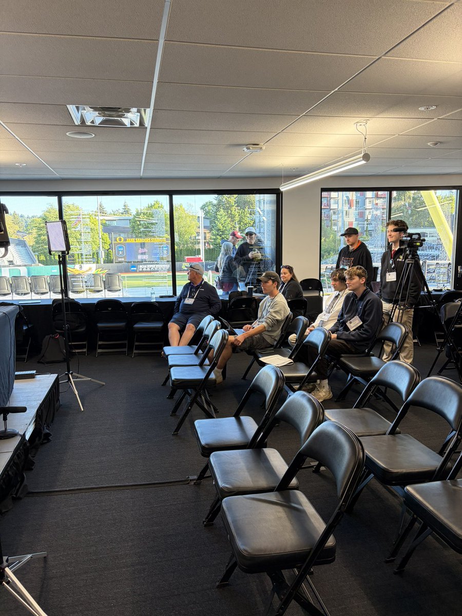 brianogden's tweet photo. Behind the scenes in Eugene:

▪️ @laniricketts10 snapping photos of @Coach_Ricketts through the glass at the press conference 
▪️ The parents’ postgame interview about their pregame broccoli delivery

It was a wild and whacky weekend out west 😅 https://t.co/97MNfD4f4o