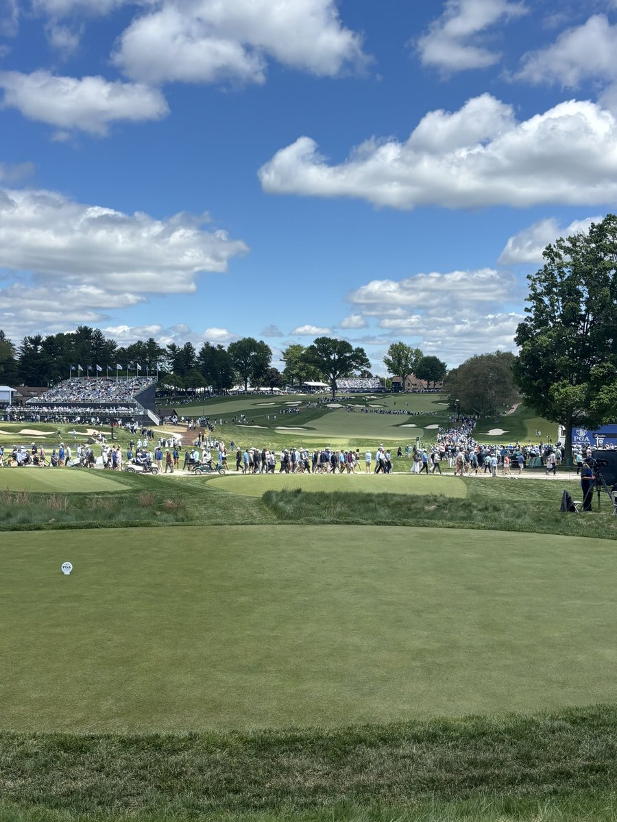 Oliver_Wilson's tweet photo. That’s the @PGAChampionship done ✔️ 

I really enjoyed @AroniminkGC probably more so from this side of the ropes. It was refreshing to see a slightly different test to a normal PGA which many players certainly didn’t adapt to. 

There were 299 three-putts in the first two rounds alone. For context, The Masters this year had 190 over all four rounds. That’s a crazy stat!

It may well be something we see more of in course setups of the future, rather than just growing the rough to boring lengths that eliminates creativity, I certainly hope so anyway. 

Hole locations being cut on steeper gradients asks a tougher question and makes players way more edgy in my opinion. When you’re nervy and you can’t feel your hands there’s nothing harder than trying to hole a left to right slider! 

Now the dry conditions helped and there is a balance of course, but Aronimink brought back the importance of angles with their wild greens & cambered fairways that tested every area of the game as a Major should. 

It exposed more of the world’s best and you could argue it allowed a fairer test instead of the typical bomb and gouge. 

Aaron was the well rounded winner the course deserved!

I’m so pleased for him and his team. Six under par on his last 10 holes, when everything was on the line was exceptional golf! 

He answered the unique questions the course asked better than anyone, and it produced a winner every bit as distinctive as the test itself. 

Thanks to the @5liveSport team of @iaincartergolf @jamesgregg7 @KDownesSport & the team back home. 

See you at The Open!