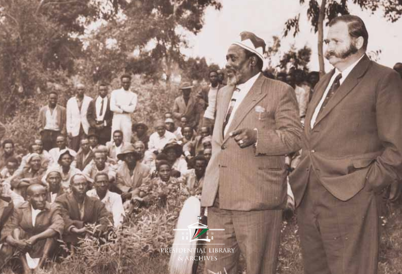 OPLMKe's tweet photo. MEMORIES MONDAY
Did you know? 
Before becoming Kenya’s first Prime Minister and later President, Mzee Jomo Kenyatta served in government as a Cabinet Minister. In 1962, Colonial Kenya Governor Patrick Renison formed a Coalition Government that served from 1962 to 1963, bringing together KANU and KADU leaders. 
Under the arrangement, Jomo Kenyatta and Ronald Ngala jointly served as Ministers of State for Constitutional Affairs, with Kenyatta overseeing Economic Planning and Ngala handling Administration.
Here, on June 1, 1962, Kenyatta stands alongside fellow minister Bruce McKenzie as they address about 500 indigenous settlers at the Muguga Forest Settlement Scheme in Kiambu.