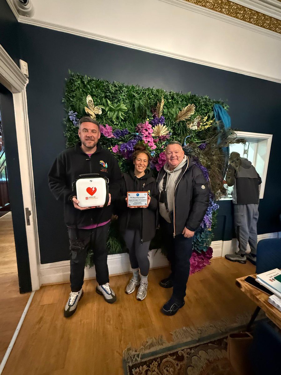 TheOKFoundation's tweet photo. Thomas, Toni and all the amazing staff and young adults from The Young Adults Respite Services in Huyton receiving their defibrillator from Mark King OBE after a fantastic morning of CPR and defibrillator training with everybody. 💙

#TheOliverKingFoundation #Defibrillator https://t.co/7GT4Iev7lK
