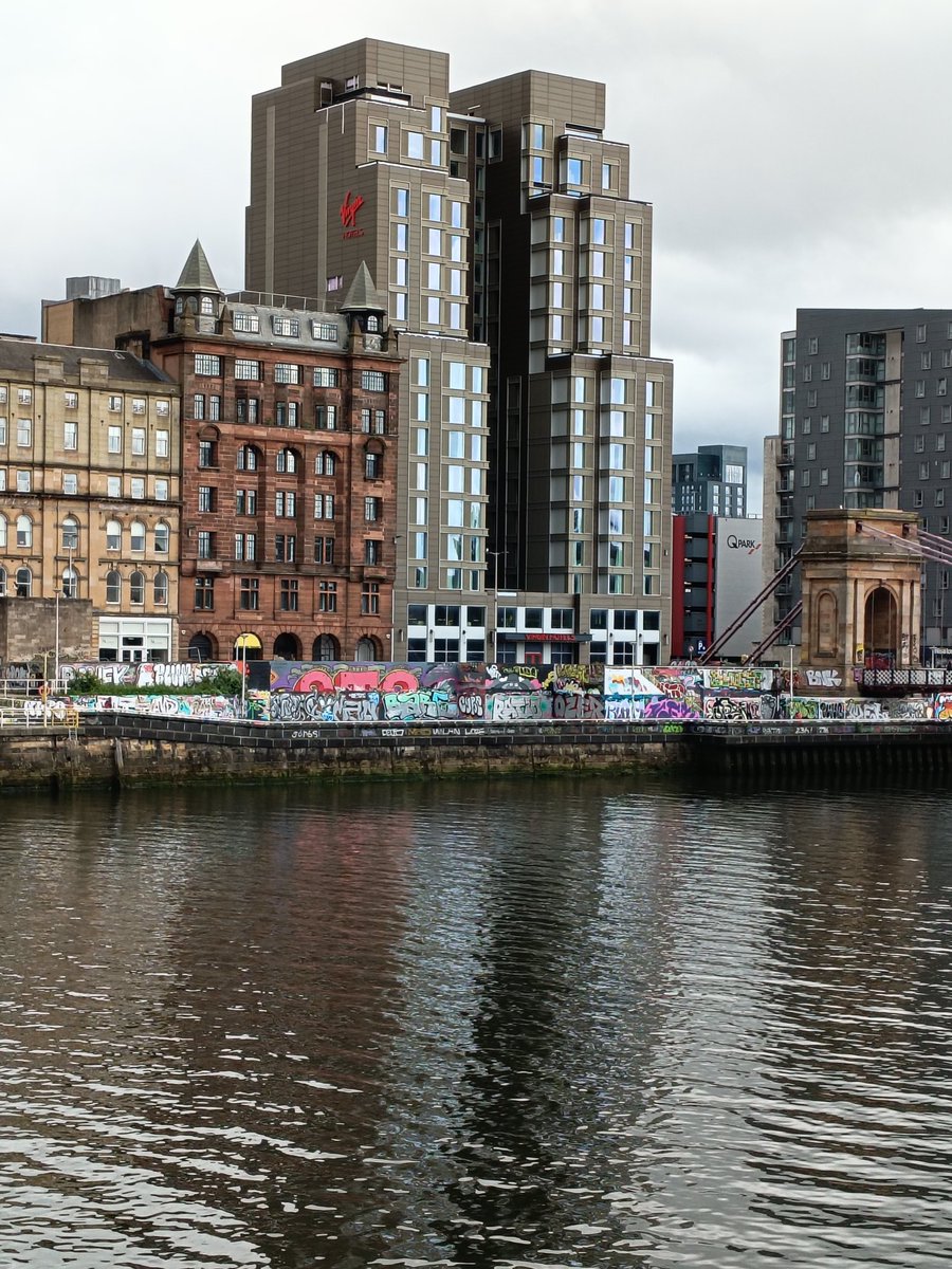 stuartf8136's tweet photo. @ThomasKerrMSP hi.we were cross the clyde on Sunday coming back from the queue.buses diverted .we noticed the new official graffiti wall in front of the new hotels.a great impression on visitors. https://t.co/RvYuCi8okj