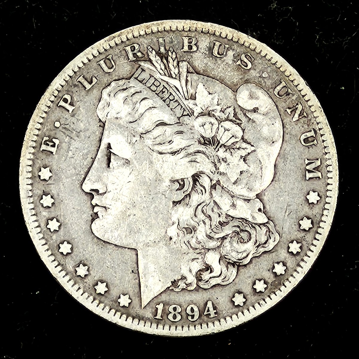 Coin_HuntersLLC's tweet photo. What makes a “key date” coin special?

Rarity!

This 1894 Morgan Dollar had a mintage of only 110,000 coins, making it one of the tougher dates in the series. 
A tiny mintmark (or lack thereof) can completely change a coin’s value!

#CoinCollecting #MorganDollar #silverstacking https://t.co/3BOuCiznPS