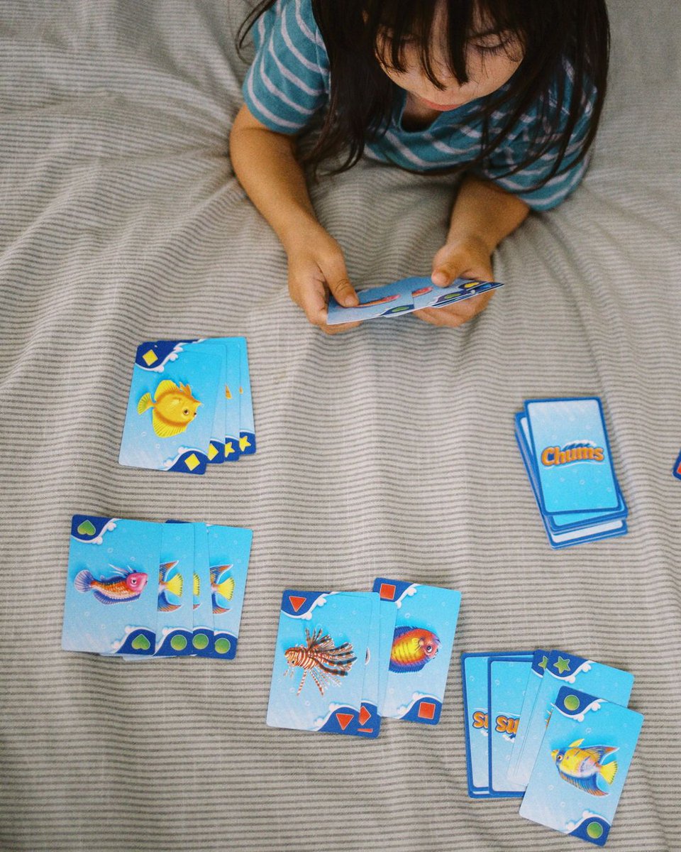 SimplyFun's tweet photo. This card game is like a trip to the aquarium 🐟 ! 

Help your preschooler learn colors &amp; shapes while they match and explore colorful fish, with Chums. 

Save 10% on 3+ portable games: https://t.co/dOZUifScQV https://t.co/YBeclsNNt0