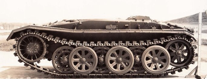 KrypTanko's tweet photo. Today’s “Odd Tank” is the 🇺🇸 American ‘M24 No. 594’

In 1946 a study on foreign running gear was conducted on a turretless M24 Chaffee Light tank, numbered as 594, which used the tracks and wheels from the Sd.Kfz. 8 halftrack (seen in picture 4). The turret was removed for this study to lower the weight of the vehicle to better match the weight capacity of the suspension system.