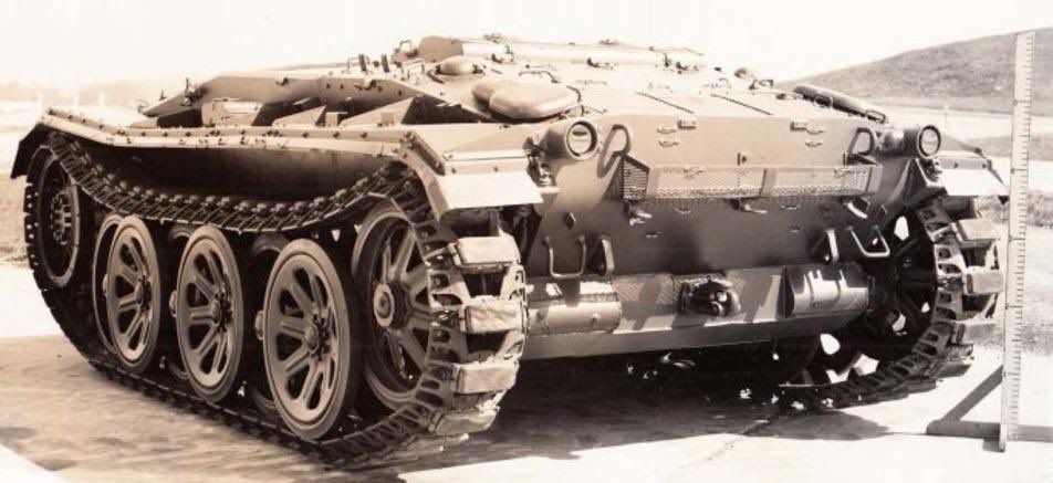 KrypTanko's tweet photo. Today’s “Odd Tank” is the 🇺🇸 American ‘M24 No. 594’

In 1946 a study on foreign running gear was conducted on a turretless M24 Chaffee Light tank, numbered as 594, which used the tracks and wheels from the Sd.Kfz. 8 halftrack (seen in picture 4). The turret was removed for this study to lower the weight of the vehicle to better match the weight capacity of the suspension system.