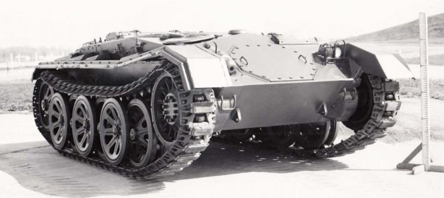 KrypTanko's tweet photo. Today’s “Odd Tank” is the 🇺🇸 American ‘M24 No. 594’

In 1946 a study on foreign running gear was conducted on a turretless M24 Chaffee Light tank, numbered as 594, which used the tracks and wheels from the Sd.Kfz. 8 halftrack (seen in picture 4). The turret was removed for this study to lower the weight of the vehicle to better match the weight capacity of the suspension system.