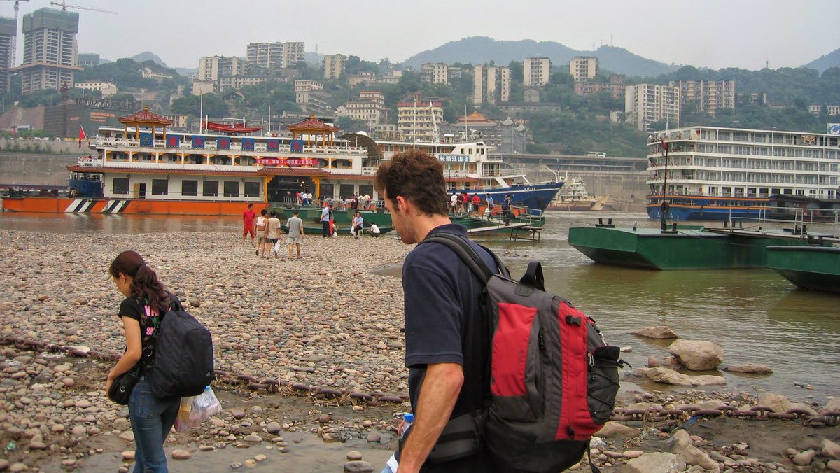 jarvis______'s tweet photo. @elonmusk Here's me about to board a boat in Chongching 20 years ago. 

We just walked over the rocks down to the river! https://t.co/jOJM1TFCAf