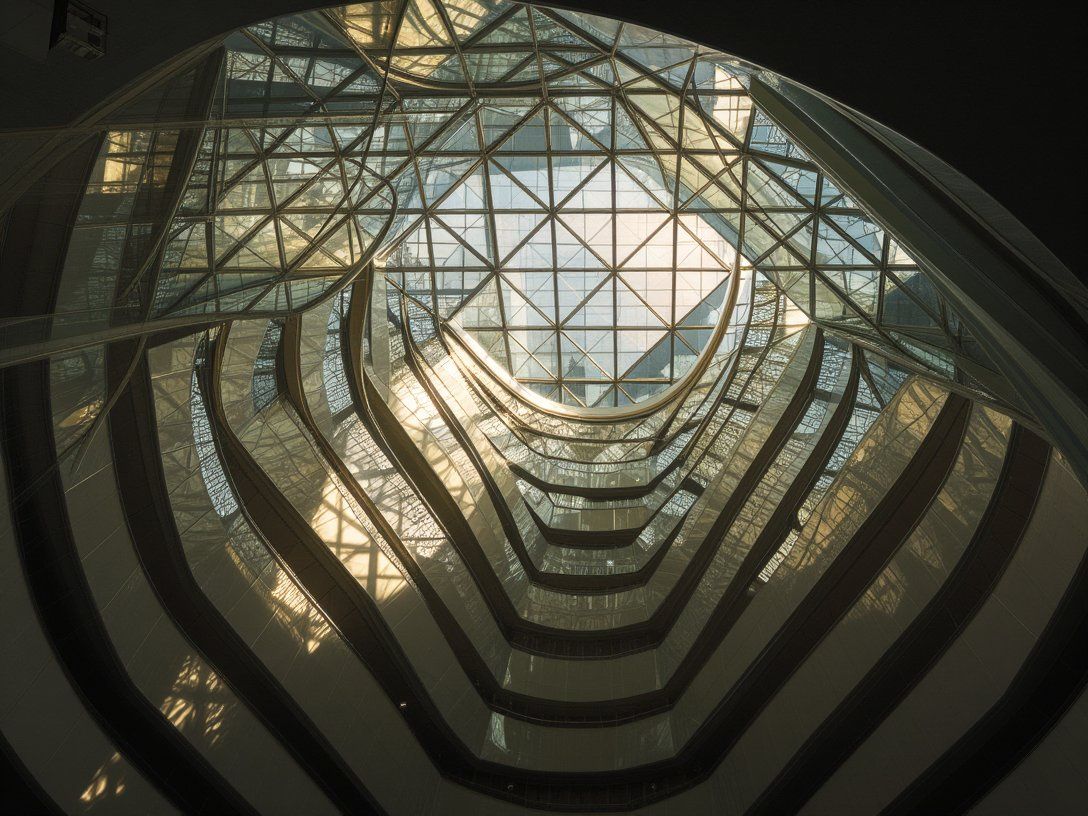 phiarch_'s tweet photo. Curved glass ribs twist into a mesmerizing spiral, casting intricate shadows below. This modern masterpiece blends light and shadow with architectural elegance. #architecture #moderndesign https://t.co/izaPyVUV3h