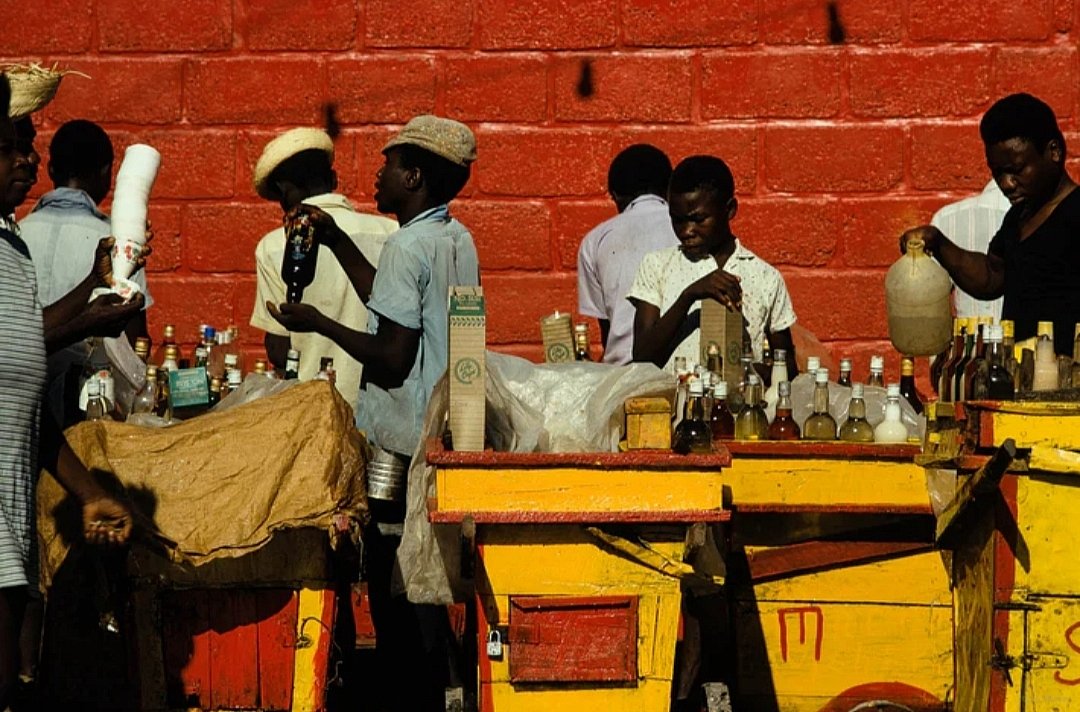 GiulietteR48567's tweet photo. Vendors with Yellow Carts, Haiti, 1973 - Jay Maisel https://t.co/fCH8t6QJ9p