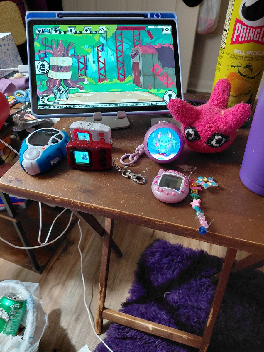 FoxCalamari's tweet photo. FoxCalamari: I love letting my Digimon roam around on my tablet while I play my Switch 2 or listen to videos on YouTube. I'm not good at pvp but I enjoy raising #Digimon Do you think I have too many V pets? I say it's not enough. @AliceStudios22 what would you say?  #Netdriver https://t.co/yzptJTkNRR