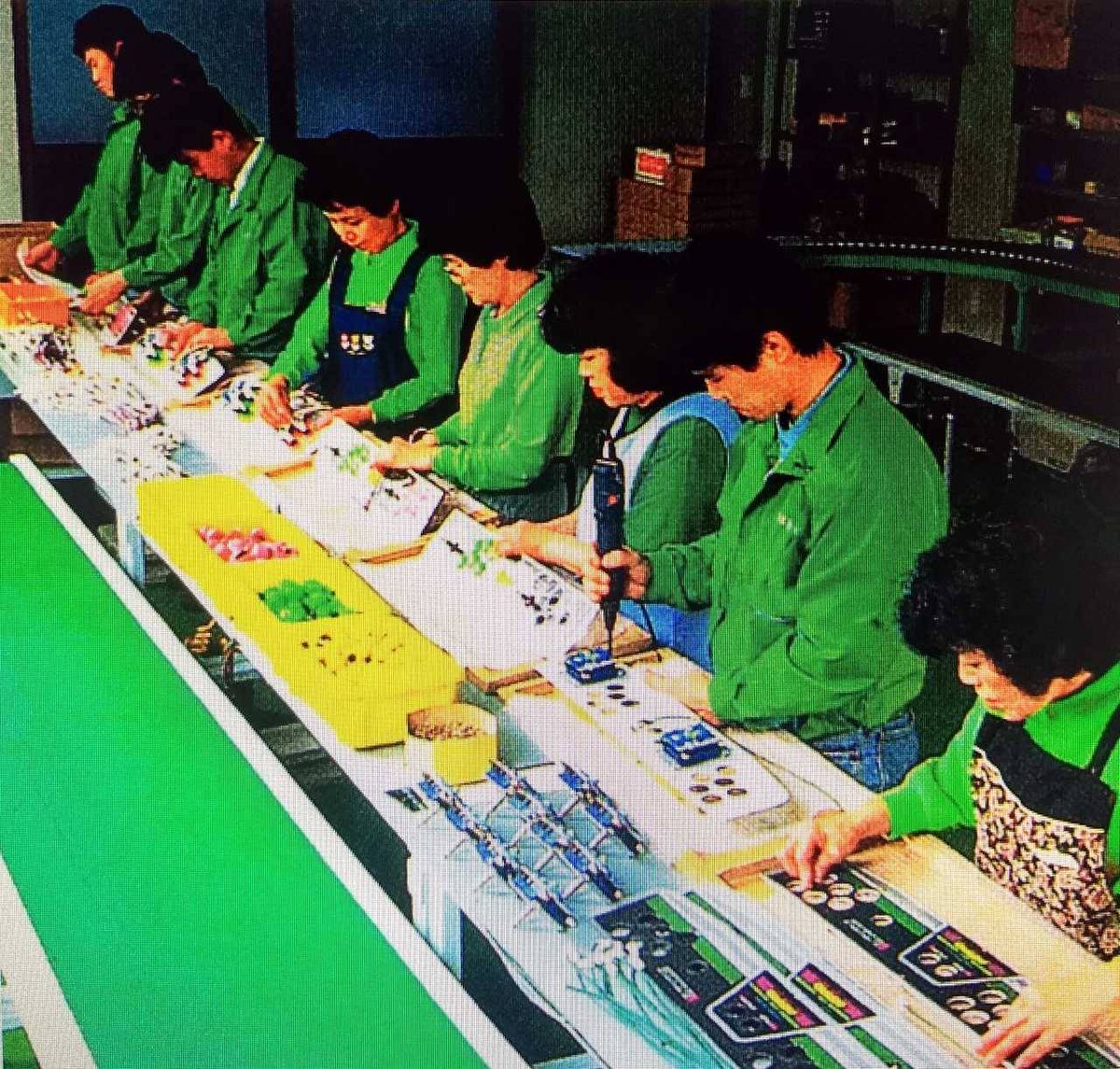 CandyCabClub's tweet photo. A rare behind the scenes glimpse of the SEGA Astro City control panel assembly line, circa 1993.

Love the trays of green/pink/yellow buttons and LS-32's getting mechanically fitted. Peak levels of care for quality and proceedure with 7 individual stations and people at work! https://t.co/DfMxdAf9Ey