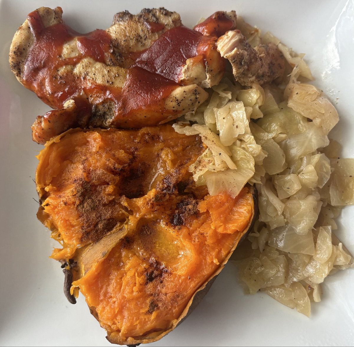 QueenHart1's tweet photo. Baked barbecue skinless chicken breast, smothered cabbage and baked sweet potato. https://t.co/CMOFo5BJzz