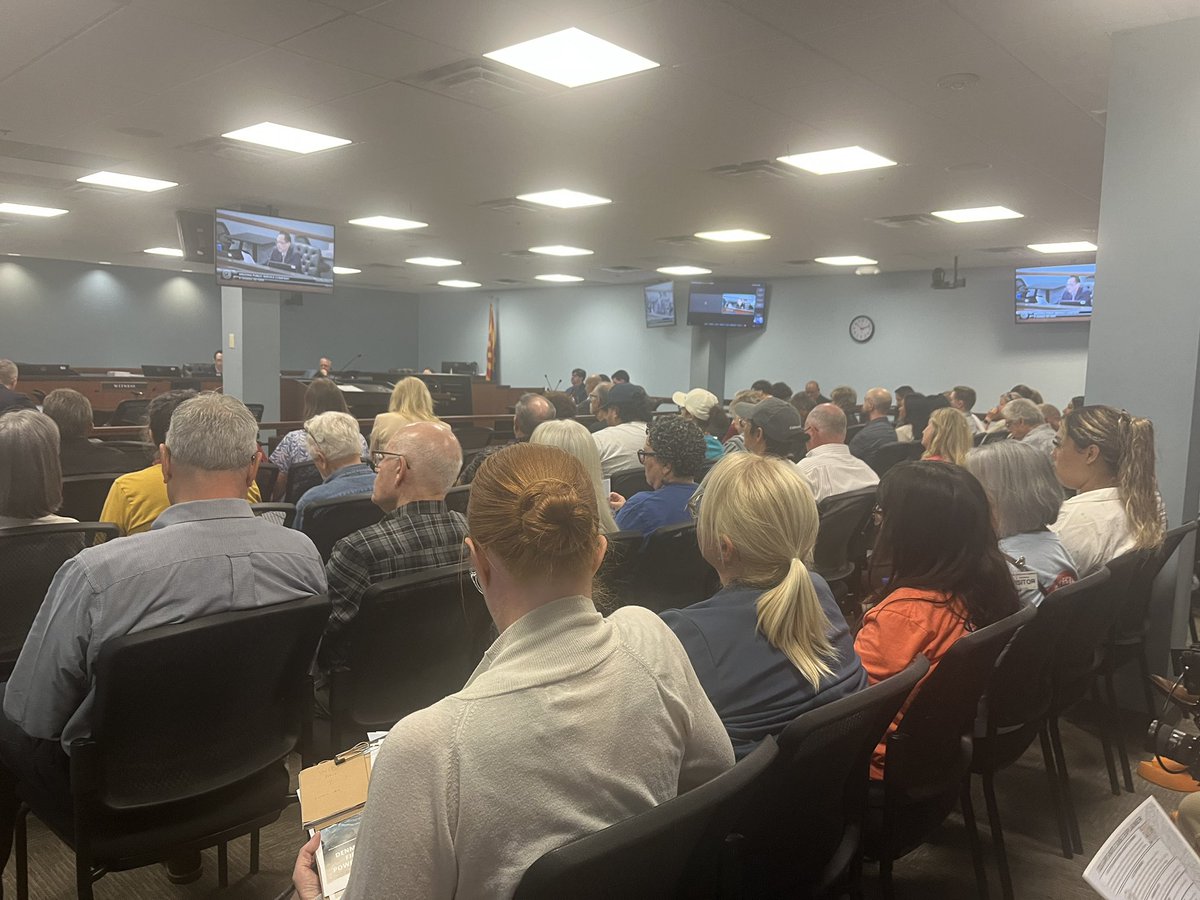 anneryman's tweet photo. A packed room at the Arizona Corporation  Commission for the APS rate hike hearing. https://t.co/AtWdyAkKFd