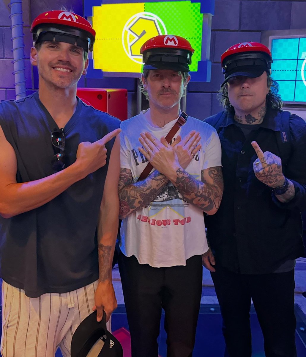 MCRupdates1's tweet photo. Mikey Way &amp; Frank Iero with Tucker Rule photographed together at Super Nintendo World. https://t.co/U3F1A3c8Cc