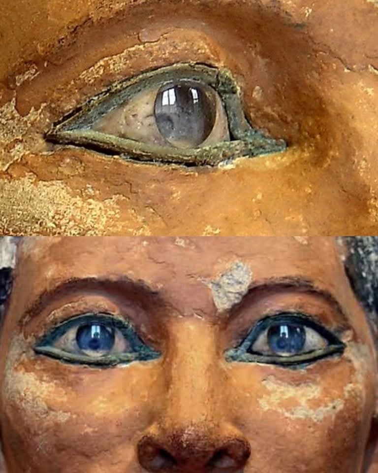 UnearthedHQ's tweet photo. The 4,500-Year-Old Eyes That Still Seem Alive 👁

Hidden behind a calm face of carved limestone, the eyes of the ancient Egyptian “Seated Scribe” have stunned historians for generations. Even after more than 4,500 years, they still appear hauntingly lifelike — as if the figure is silently watching everyone who passes by.

Created during Egypt’s Old Kingdom period, around 2600–2350 BCE, the statue is believed to represent a high-ranking royal scribe, a man whose role was among the most respected in ancient Egyptian society. While pharaohs ruled the land, scribes controlled knowledge itself. They recorded taxes, laws, religious texts, and royal commands in a civilization where very few people could read or write. In many ways, they were the memory keepers of Egypt.

The statue was discovered in 1850 at Saqqara, near the tombs of ancient nobles. But what truly shocked archaeologists were the eyes.

Unlike ordinary stone carvings, these eyes were crafted with astonishing detail using rock crystal, polished white magnesium carbonate, and copper framing. Ancient craftsmen carefully shaped each layer to imitate a real human eye. Light enters the crystal surface and reflects from inside, creating a moist, living appearance that still feels unsettling today. Standing before it, many people describe the strange feeling that the statue is somehow aware of their presence.

No one knows the exact artist who created this masterpiece. Ancient Egyptian artists rarely signed their work, yet their skill rivaled some of the finest sculptors in history. Every curve around the eyelids, every reflection in the pupils, was designed to preserve not just a face — but a presence.

The “Seated Scribe” was not made simply as decoration. Egyptians believed statues could serve as spiritual vessels for the soul in the afterlife. A realistic face allowed the spirit to recognize its earthly form. These eyes were meant to stay open forever… watching eternally between the worlds of the living and the dead.

And perhaps that is why, thousands of years later, people still stop and stare back into them — wondering if the ancient gaze staring out from the stone is truly lifeless at all.
