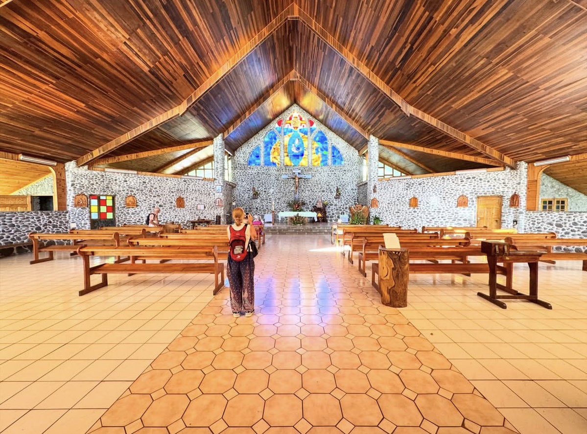 PopularCruising's tweet photo. Another beautiful open-air cathedral - this time with colorful stained glass representing Marquesan patterns – on the island of Tahuata via @aranuicruises #Aranui5 #CruiseTravel #TahitiCruise https://t.co/1Gelcb1Cdk