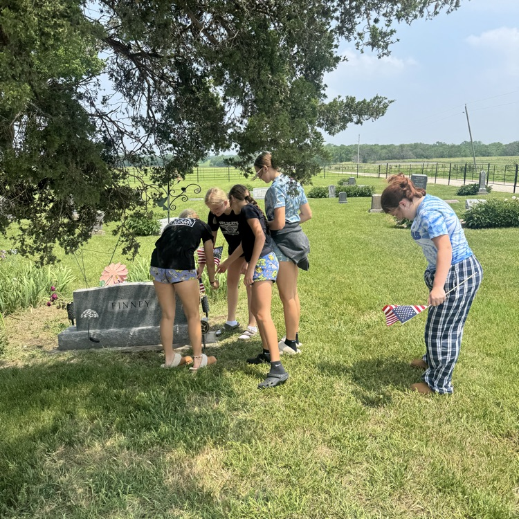 USD251's tweet photo. Junior high students replacing flags at three cemeteries around Americus.  Memorial Day is a time to reflect and honor all those service members who gave the ultimate sacrifice by protecting and defending the country they loved!  Thank you military for your service. https://t.co/zFy5bklLok