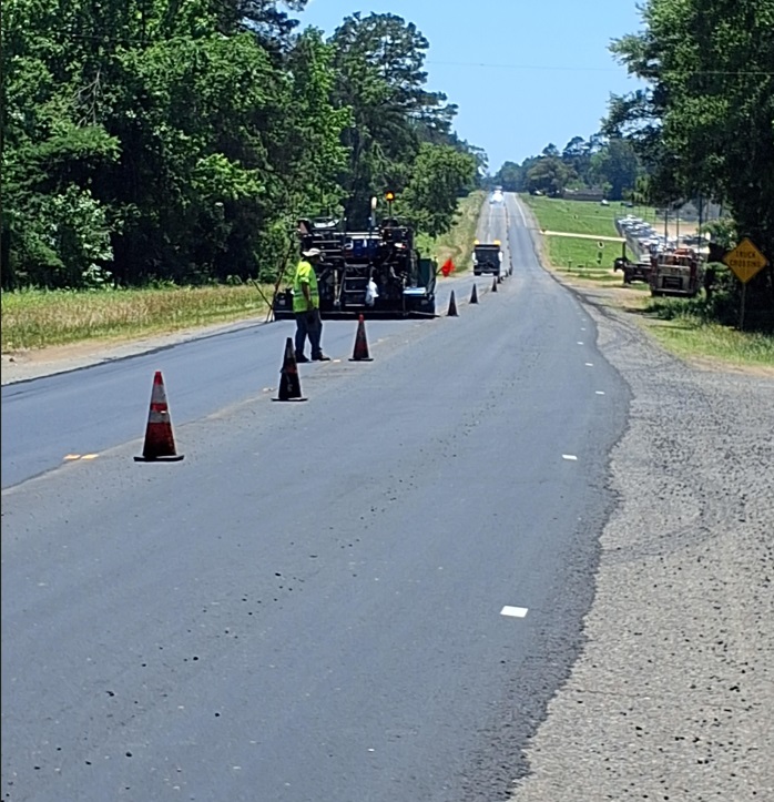 La_DOTD's tweet photo. DOTD crews recently conducted asphalt paving operations on a section of US 84 west of Mansfield in DeSoto Parish. This critical maintenance work provides a safer and more enjoyable driving experience for motorists, and extends the service life of the roadway. https://t.co/CB2XCKe080
