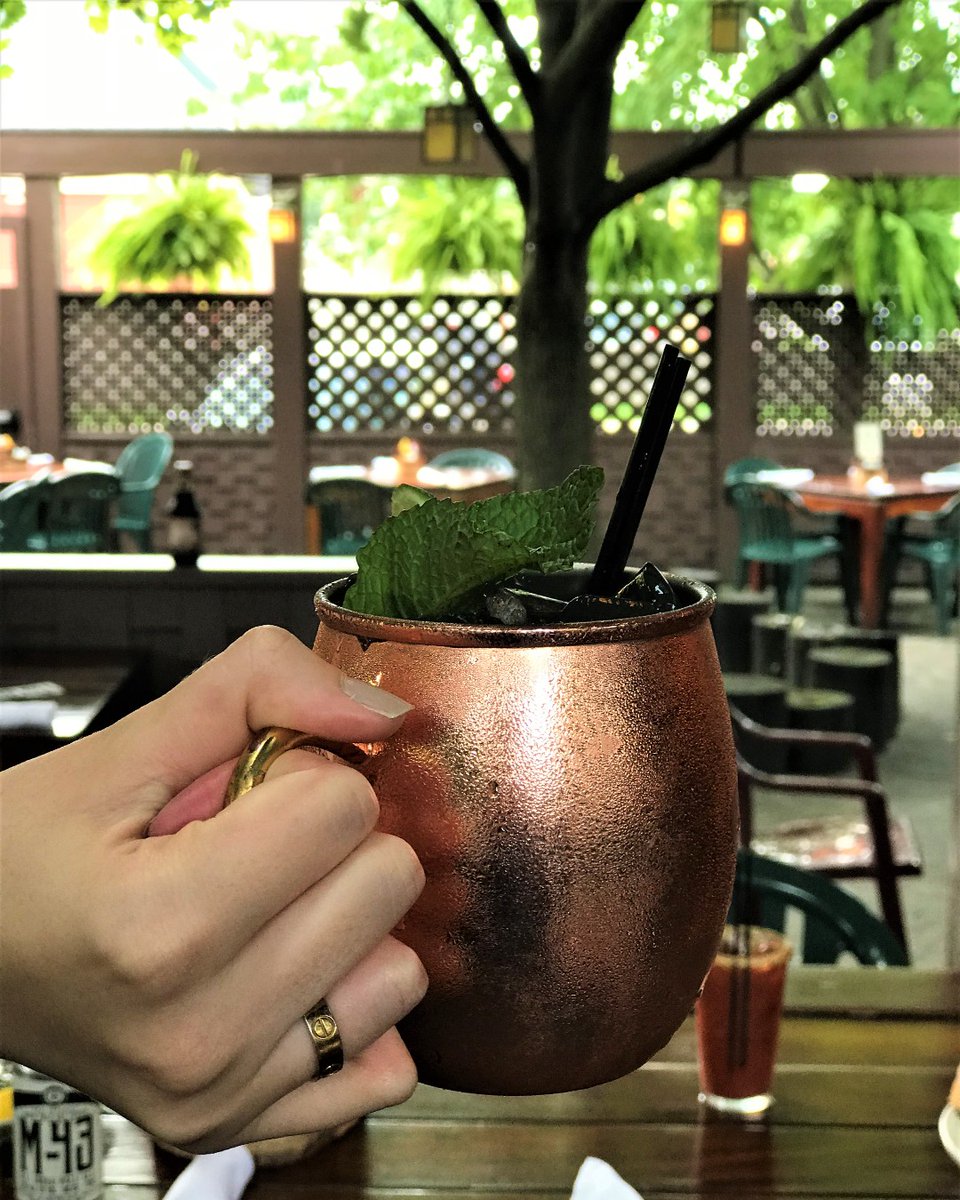 moosepreserve's tweet photo. Sun filtering through the trees, a Moscow Mule in hand—this is what patio season looks like at The Moose Preserve. https://t.co/V7uF46E8ya
