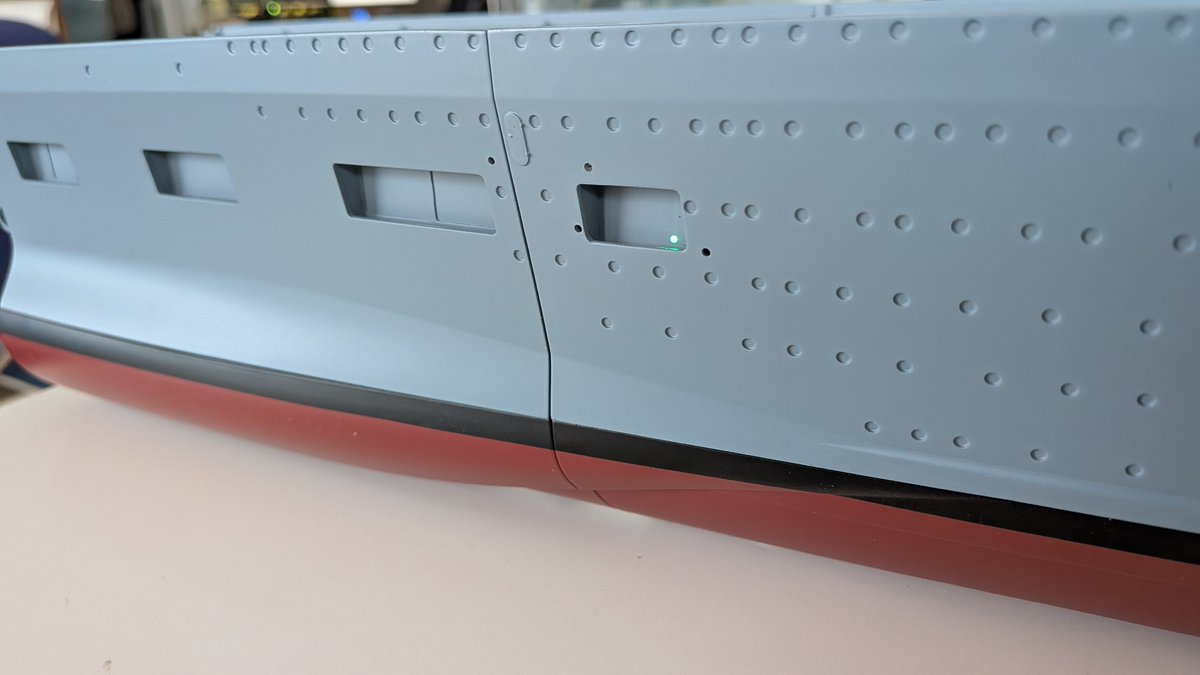Scratchbr1's tweet photo. Step 37/140:The starboard hull was sealed with a glued internal cover, followed by installation and testing of the green navigation light.

#Scalemodels #Hachette #Grafzeppelin  
#Kriegsmarine #WW2 #aircraftcarrier #cv https://t.co/QEHv2BJU9S