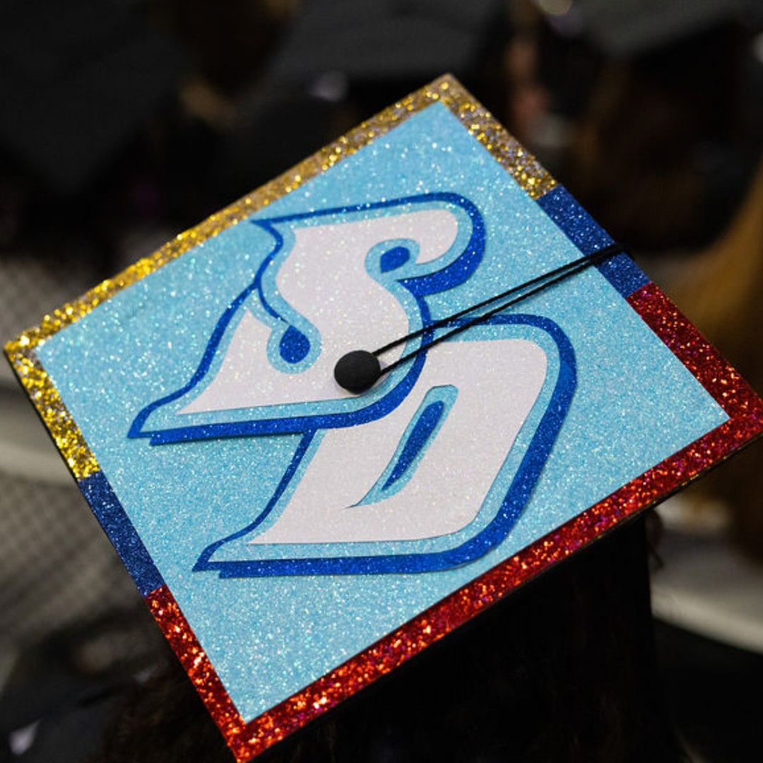GoUSDAlumni's tweet photo. It's more than a graduation cap, it's family 💙 https://t.co/jdvwQjrN89