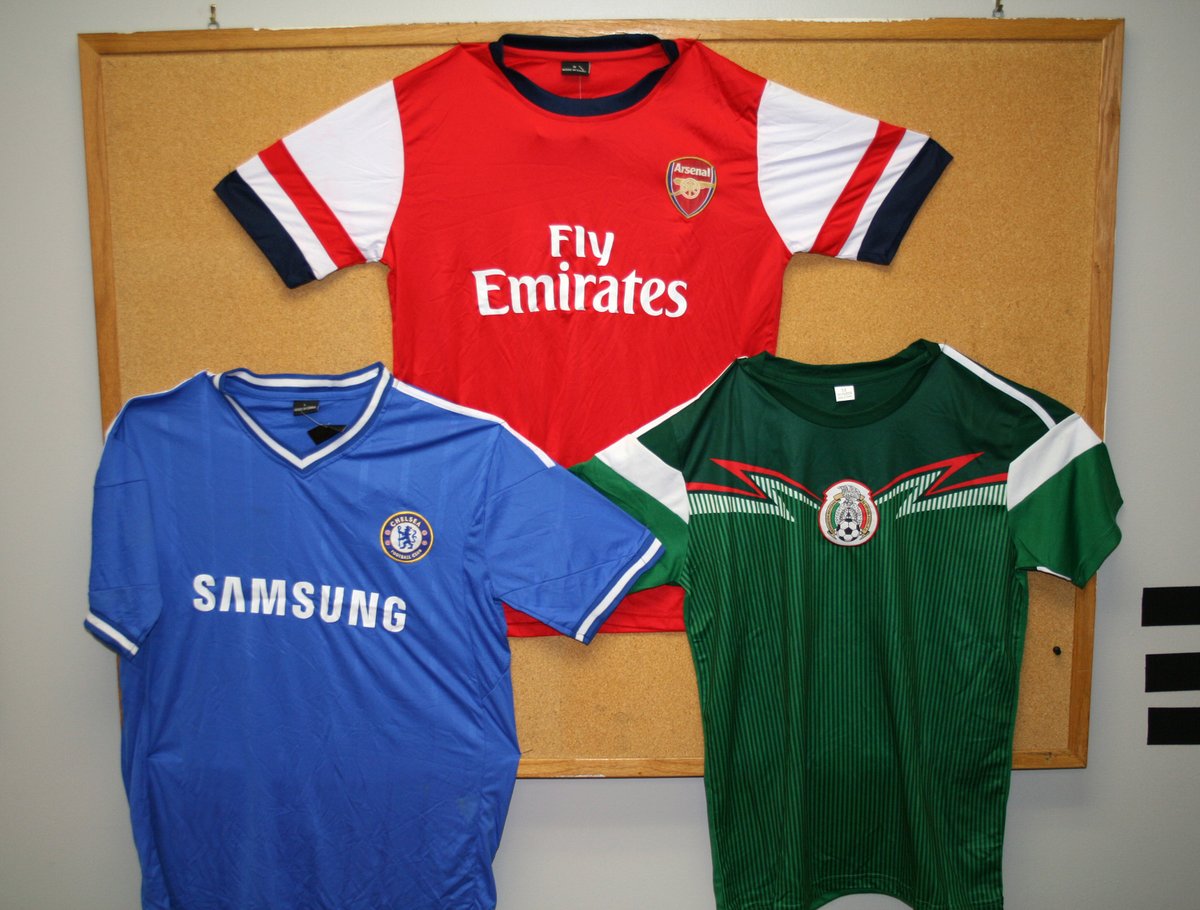 CBPTradeGov's tweet photo. The #FIFAWorldCup is almost here, but @CBP is stopping fake sports merch all year long!

CBP is doing our part to seize counterfeit sports gear at the border, but you can help too. Only shop from trusted retailers and look for official logos before you buy. Don’t let counterfeits ruin your game day celebration!

#CBPxFIFA2026 - protecting the fans, securing the game.

Learn more: https://t.co/qKCqPdjiEv