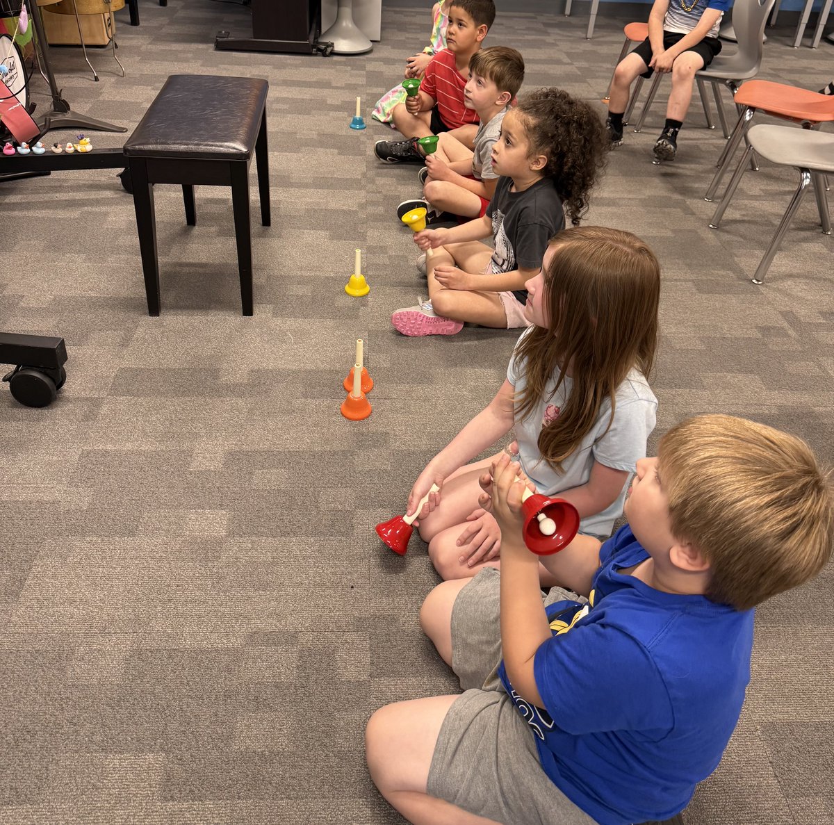 MrsKrase's tweet photo. Mrs. Syrowski’s kindergarten class playing melodies on the walking piano and hand bells https://t.co/YCzGxHNXGR