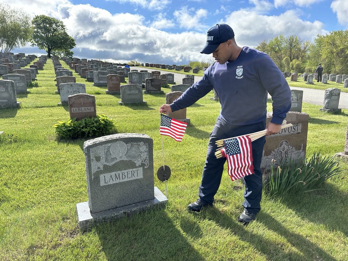 WorcesterPD's tweet photo. Remembering those we have lost. Academy Class 01-26 recently placed 5,000 American flags at Notre Dame Cemetery ahead of Memorial Day. https://t.co/ywuE86rLN1