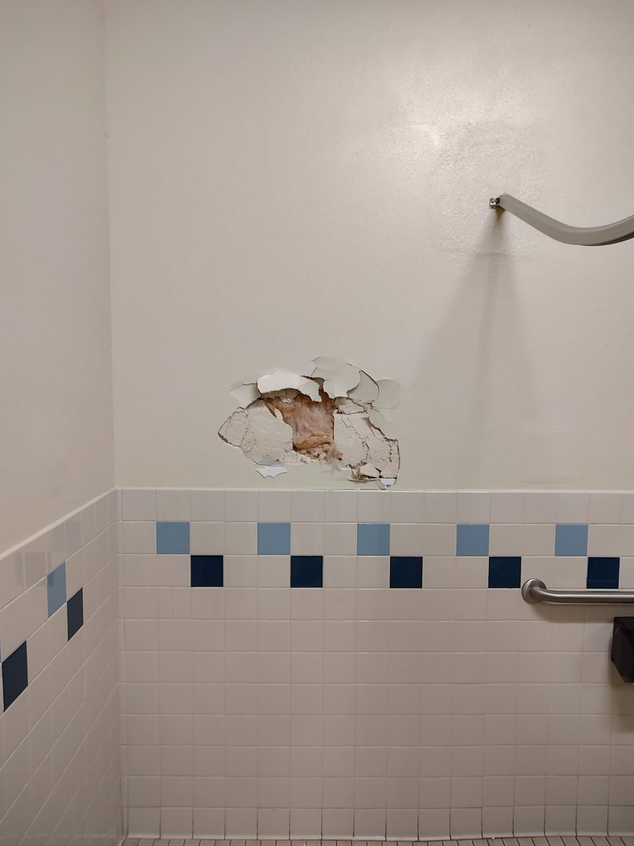 Rage45644's tweet photo. Oh nothing, just the hole in my schools bathroom wall getting progressively worse https://t.co/X5St7YatdM