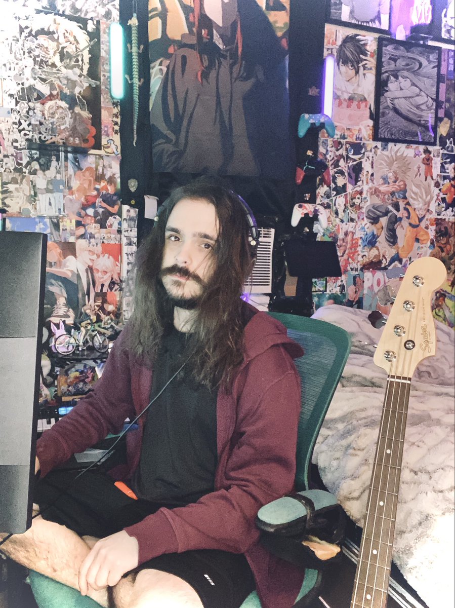 _Emulator's tweet photo. Location: Dingy New York Apartment 
Description of Subject: 
Sad hairy man in his early 30s, writing his millionth melancholy song, doing nothing with his life. Subject appears to be slightly stoned and still living like it’s the early 2000s.
Source: Unknown - Colorized - 2026 https://t.co/ZkEJfjgN5z