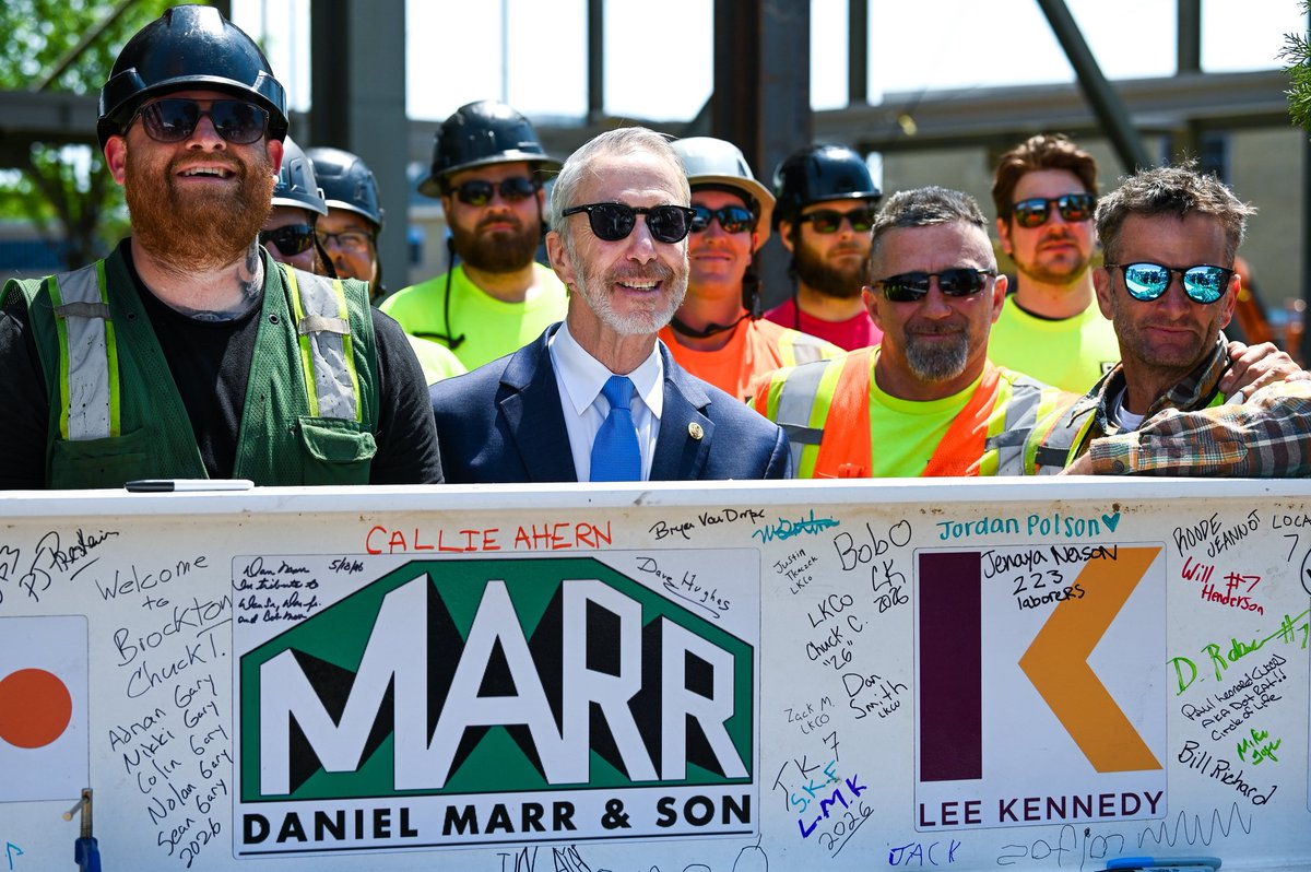 RepStephenLynch's tweet photo. Yesterday marked another huge milestone in the journey to bring the Martin Richard Boys and Girls Club Fieldhouse+ to life in Dorchester, with the Topping Off Ceremony skillfully performed by my brothers and sisters at Ironworkers Local 7. 

I was proud to join @TeamMR8, the Marr Family, Lee Kennedy Construction, Bill, Denise, Jane, and Henry Richard, Bob Scannell and the @BGCDorchester, and my dedicated colleagues in Government, @mayorwu529, @nickcollinsma, Reps. @RepDanHunt, @david_biele, Chris Worrell, and Councilors Fitzgerald, @ErinforBoston, @Ruthzee, and @VoteWorrell for this celebratory day.
 
When complete, this facility will open its doors to thousands of young people and families across our community, offering access to athletics, the arts, mentorship, and so much more for generations to come. I am also proud that every part of this structure is the product of 100% Union Labor.
 
More than a building, the Fieldhouse+ will be a living embodiment of young Martin Richard's spirit, of kindness, generosity, and peace. That spirit is woven into every part of this project, and it will continue to inspire and shape every young person who walks through its doors.
 
We are grateful to @MassGovernor  and Senators @SenWarren and @SenMarkey, and to the many generous donors, and of course, for the love that Bill and Denise Richard have shown to all the children of our City, all in memory of their son, Martin Richard.