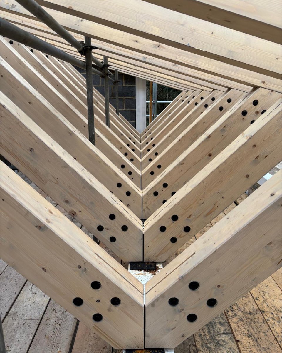BucklandTimber's tweet photo. Spruce #Glulam rafters and trusses coming together on site, supported by a steel structure for this bespoke build. A great example of timber and steel working together. Good to support Inspired Designs on this one, and see the installation progressing nicely. https://t.co/SRrC5kY89x