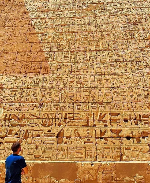 HerodotusWave's tweet photo. The intricate hieroglyphic inscriptions carved into the walls of the Temple of Ramesses III at Medinet Habu on the West Bank of Luxor, Egypt. https://t.co/SWNwDPridn