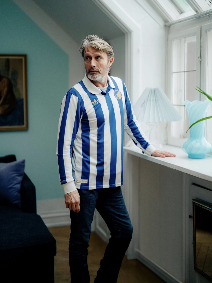 FCKobenhavn's tweet photo. Meet the Copenhagener, Mads Mikkelsen.
 
150 years of Kjøbenhavns Boldklub is not only a story about football.
It is a story about Copenhagen. About ambition. About daring to believe that where you come from should never define how far you can go.

That is why Mads Mikkelsen became part of our tribute to KB’s 150-year anniversary on April 26th. As the voice of our campaign film, he helped tell the story of a club shaped by generations of Copenhageners — and of the city that shaped them in return.

Because Mads embodies the spirit of KB.
Rooted in Copenhagen. Respected far beyond it.

From the streets of this city to one of the most remarkable careers in Danish cultural history, he stands as proof that talent means little without dedication, and that big dreams begin with the courage to pursue them.

For 150 years, KB has been a place for those who dare to aim higher.
