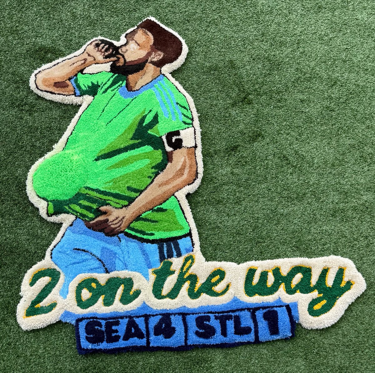 SoundersFC's tweet photo. Sounders win = new rug 🤝

@mg_carpet made a rug for each of our wins this season. He came to the facility to surprise Cristian with a custom one following his 400th appearance! https://t.co/olVZJ3EHU7