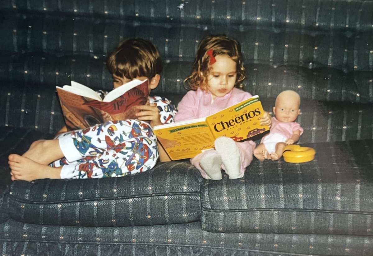 TravisJoynson's tweet photo. Me and my sister Emily sitting on the family couch together as kids.

I was reading Harry Potter and she was reading a Cheerios book.

Moments like this make life worth living.

#familycouch #harrypotterfan #cheerios #life https://t.co/0PcH77WzE3