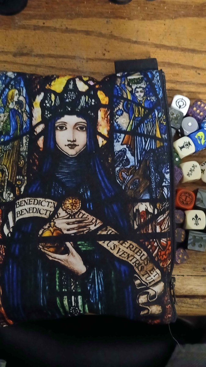 RikaSwiftblade's tweet photo. I love my Sisters of battle themed dice bag, best thing I ever found in a clothing store. She's holding a holy hand grenade!

#warhammer40k #AdeptaSororitas https://t.co/GfvYRuc2Vq