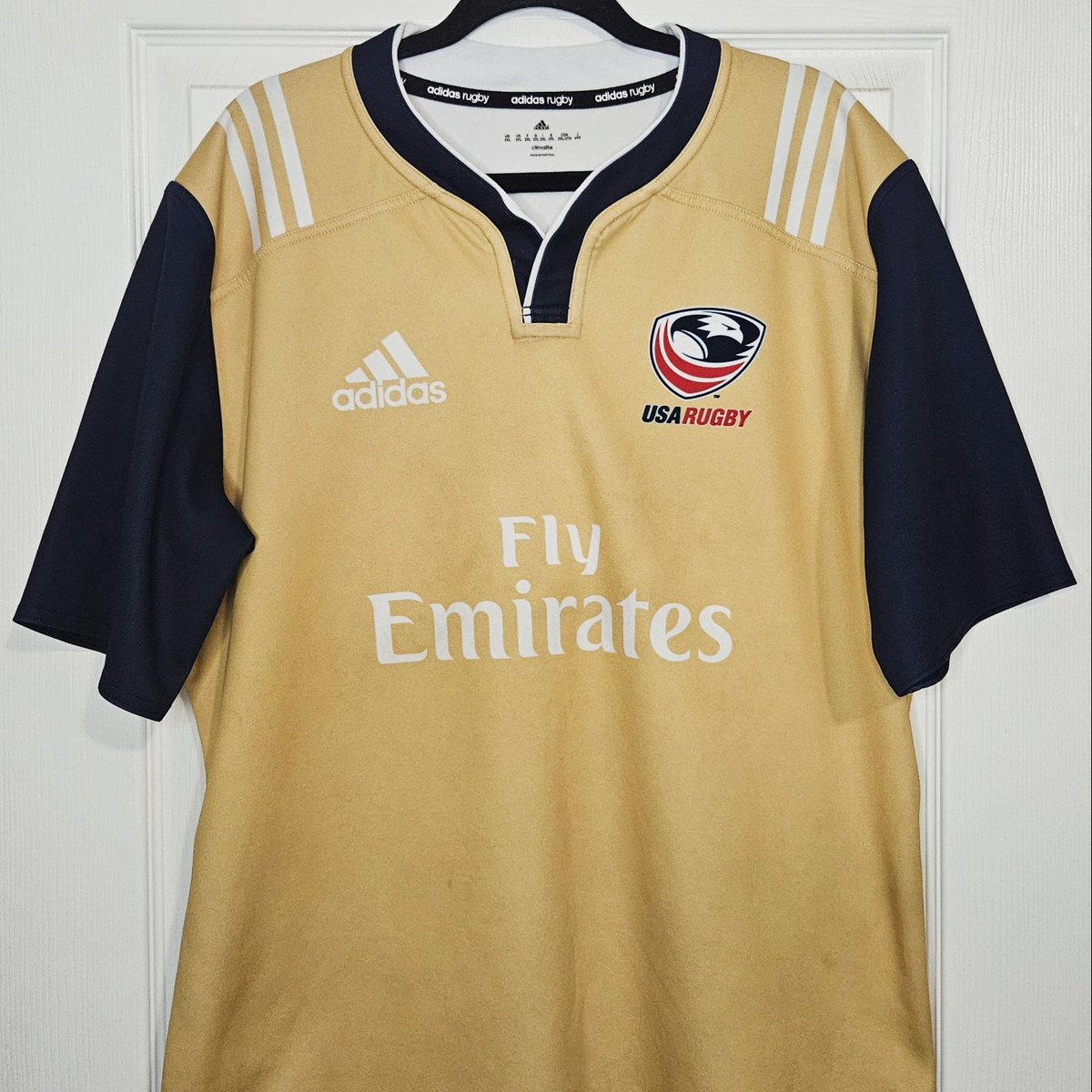 BrocksKitCloset's tweet photo. The Eagles. 2018 @USARugby training shirt. Great adidas rugby shirt with the 3 stripes and thicker material. Gold colorway keeping the USA navy accents. Simple but perfect template. Worn by Joshua Whippy. Thanks for the shirt. ❤️🤍💙💛🏉 #usarugby #kitcollector #rugbyshirt https://t.co/ULUWAKYRmA